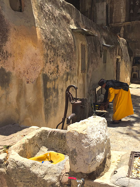 Nun in Coptic Church courtyard